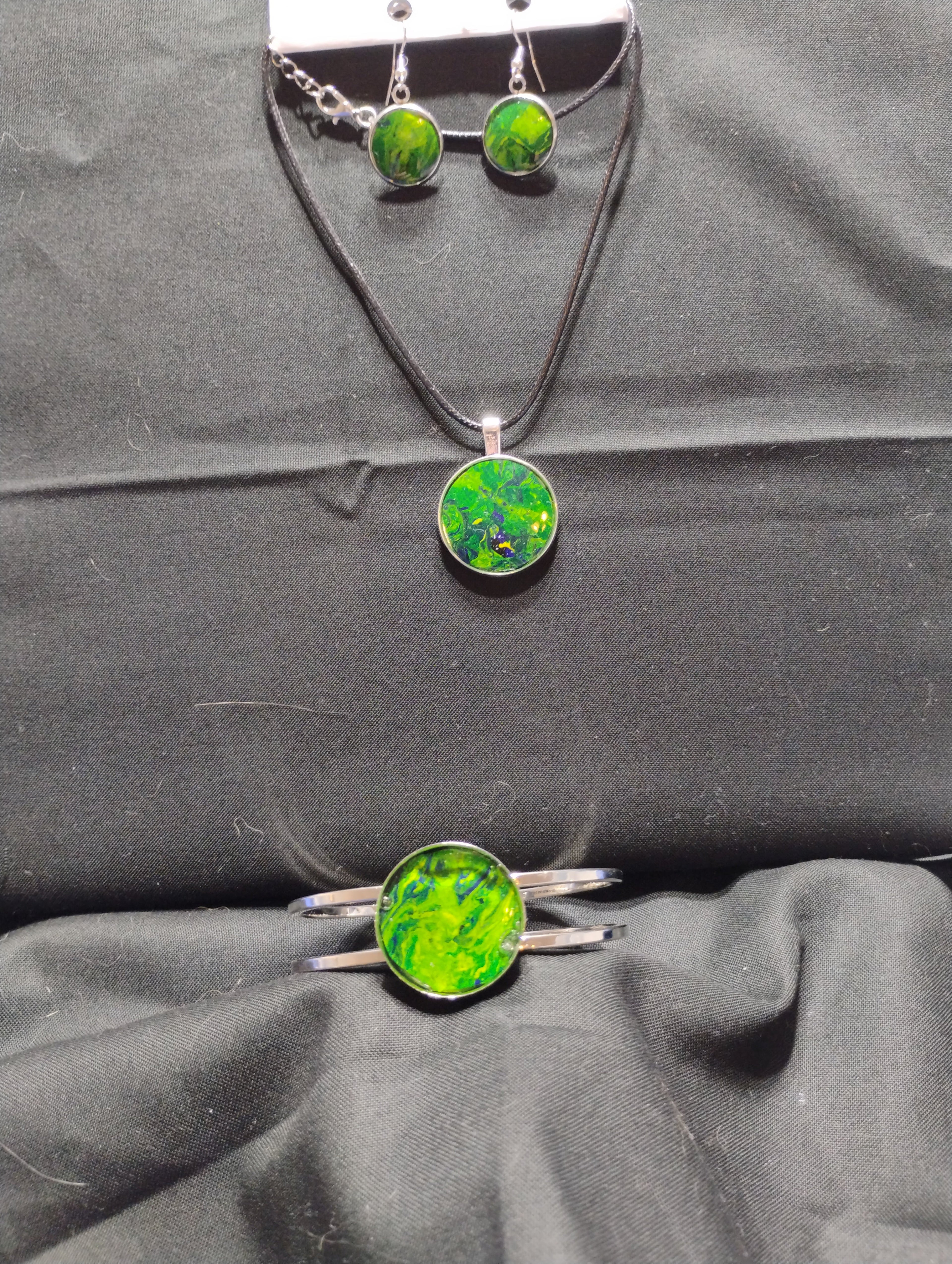 Custom Green Jewelry Set on a Black Backround.